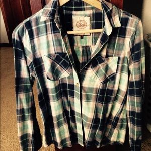 Blue plad button up shirt.